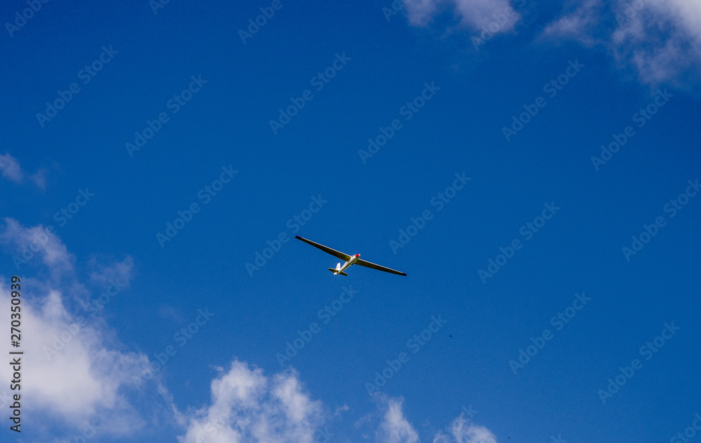 Glider plane riding the thermals high above Latriff Fell, Keswick, Cumbria, UK Glider plane riding the thermals high above Latriff Fell, Keswick, Cumbria, UK