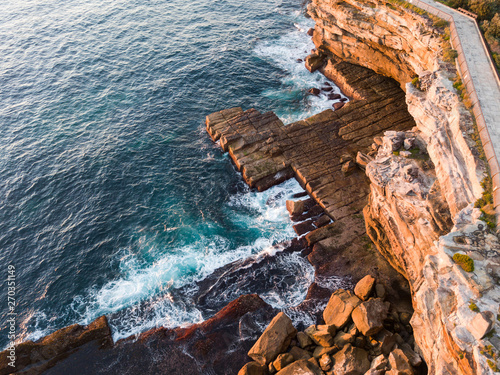 Aerial view of rocky coastline in the morning.