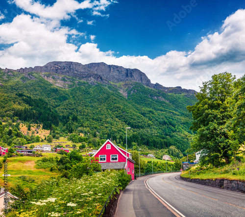 Empty road in Norwagian town - Odda, Hordaland county, Norway. Beautiful summer view of North. Traveling concept background.