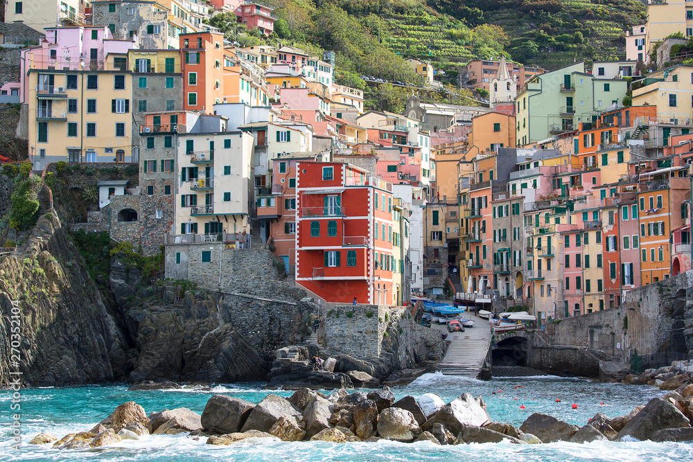 View on seaside and typical houses in small village, Riomaggiore, Cinque Terre, Italy