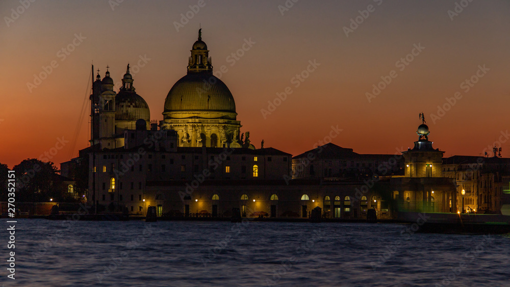 Classic sunset Venice on the Grand Canal near the Basilica of Santa Maria della Salute, Venice. Romance, travel concept