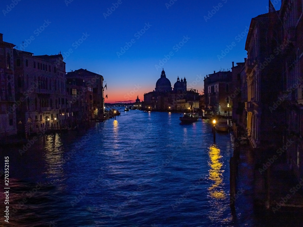 Venice is a beautiful and fascinating sunrise on the Grand Canal near the Basilica of Santa Maria della Salute, Venice. Romance, travel concept
