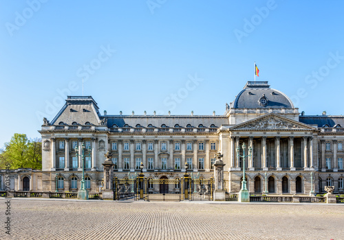 Front view of the colonnade and left wing of the Royal Palace of Brussels, the official palace of the King and Queen of the Belgians in the historic center of Brussels, Belgium, on a sunny day.