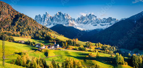 Magnificent panorama of Santa Magdalena village in front of the Geisler or Odle Dolomites Group. Colorful autumn sunset in Dolomite Alps, Italy, Europe. Beauty of countryside concept background. © Andrew Mayovskyy