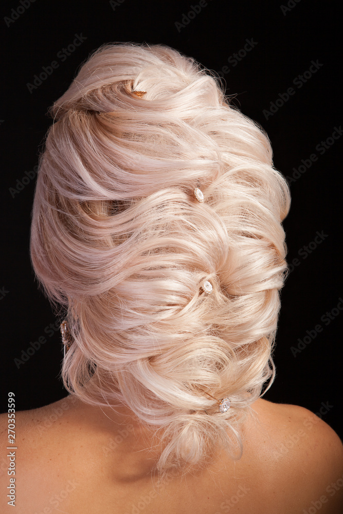 Women model shows haistyle with ornament for the bride isolated on studio background