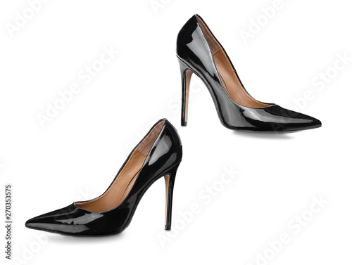 Pair of stylish high-heeled female shoes on white background