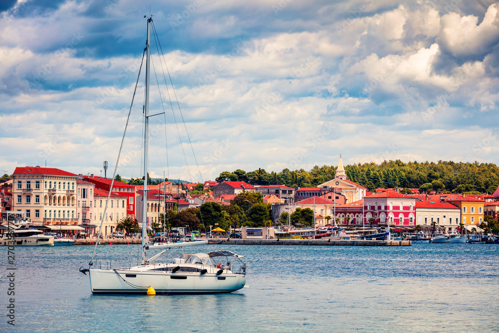 Colorful morning cityscape of popular summer resort Porec. Bright spring seascape of Adriatic Sea. Great  scene of Istrian Peninsula in western Croatia, Europe. Traveling concept background.