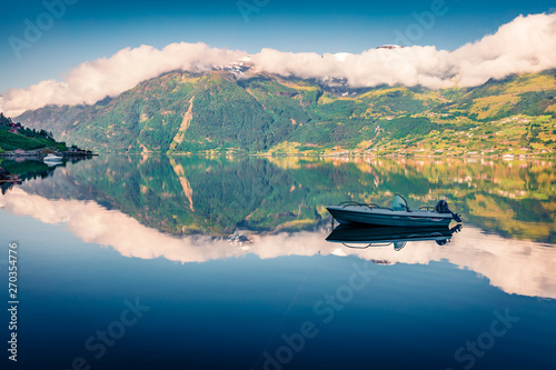 Nice summer view on the Norwegian fjord, located near Lofthus village in Ullensvang municipality, Hordaland county, Norway. Beauty of countryside concept background. © Andrew Mayovskyy