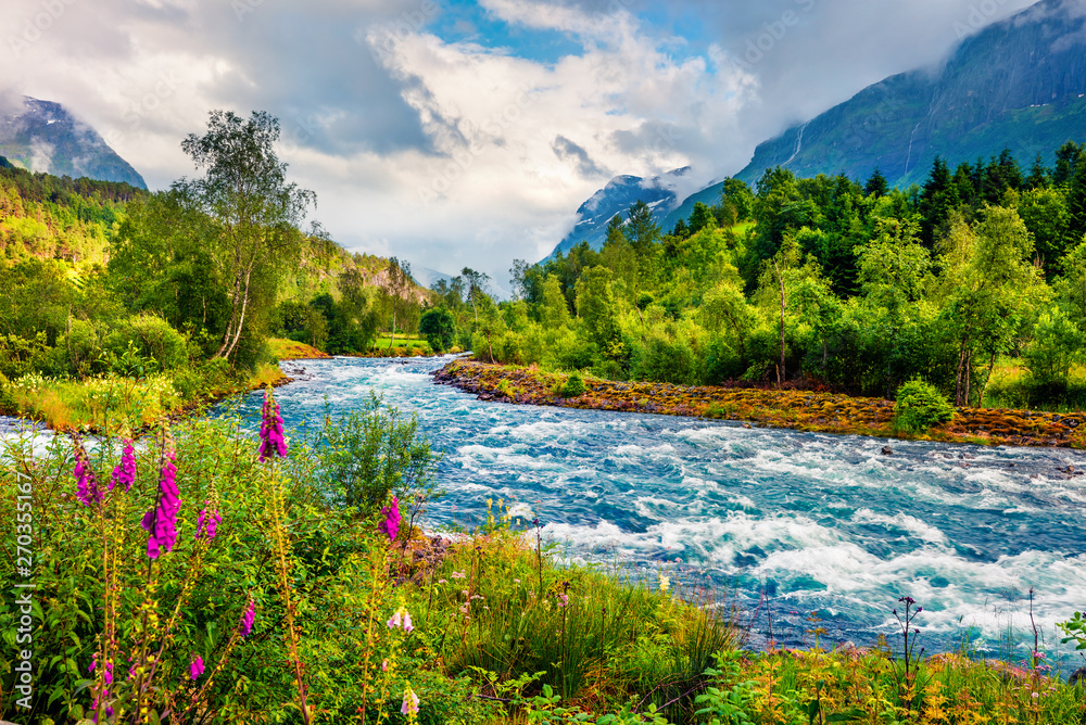 Dramatic summer view of Loelva river, located near Loen village ...