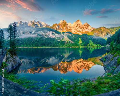 Impressive summer morning on the Vorderer Gosausee lake. Colorful sunrise in Austrian Alps, Salzkammergut resort area in the Gosau Valley in Upper Austria, Europe. Beauty of nature concept background. © Andrew Mayovskyy