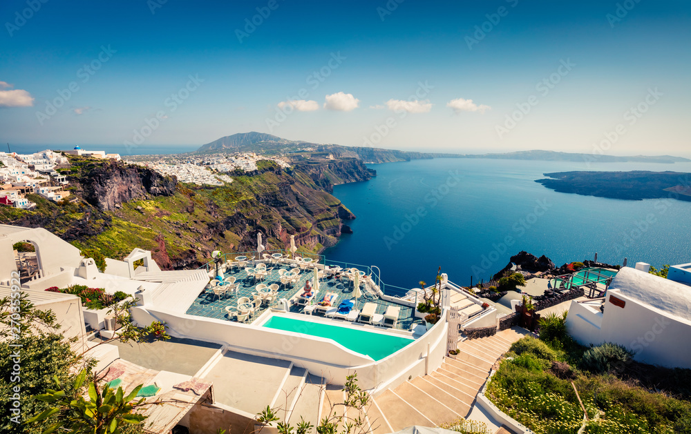 Sunny morning view of Santorini island. Picturesque spring scene of the famous Greek resort Thira, Greece, Europe. Traveling concept background.