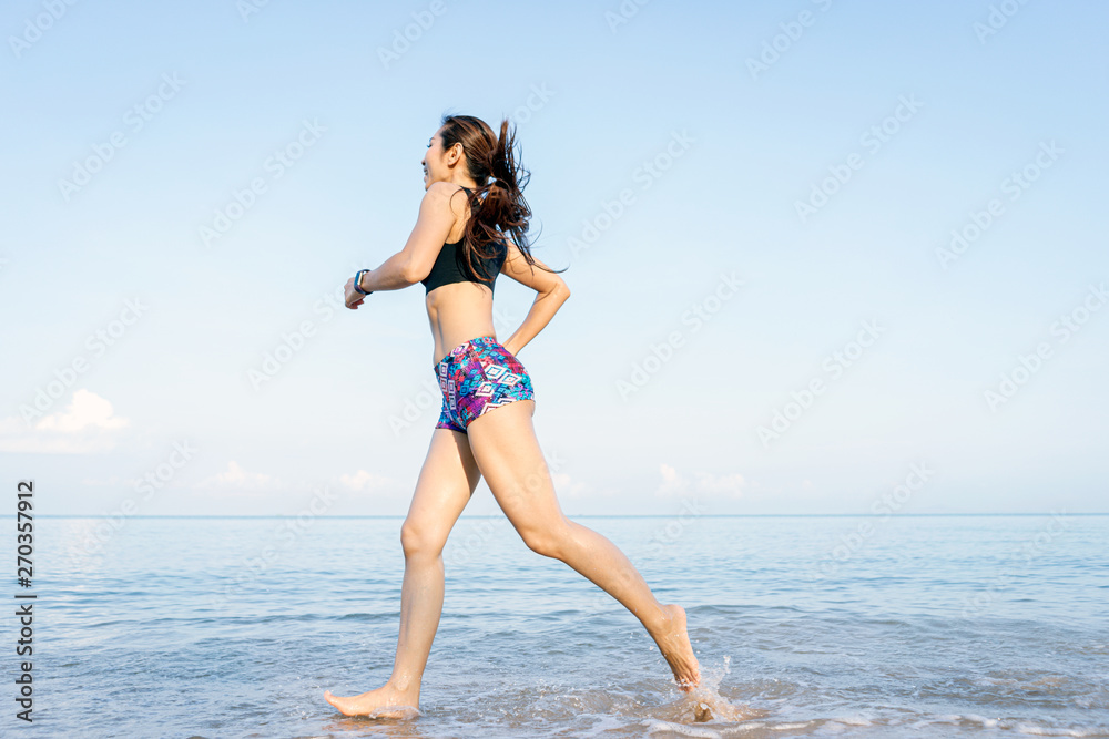 Middle-aged women who running by the sea. focus on leg. good health and happiness concept. Middle-aged women who running by the sea. focus on leg. good health and happiness concept.