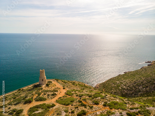 Torre del Gerro tower. Ancient 16th century watchtower on the top of a cliff in Denia, Spain