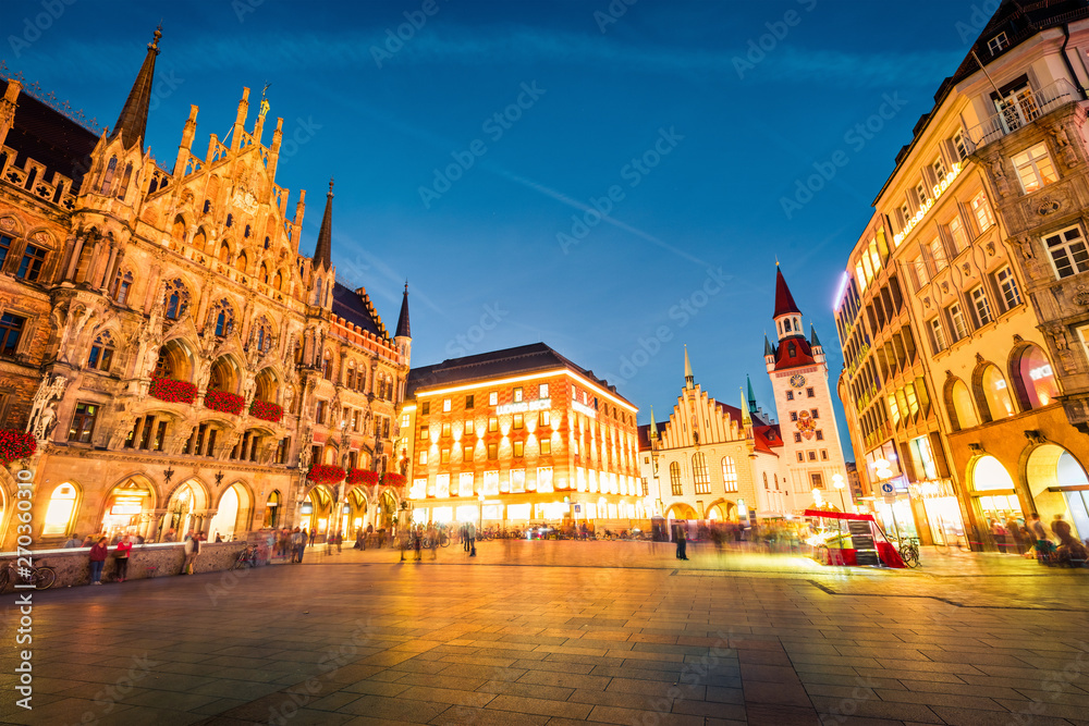 Gorgeous evening view of Marienplatz - City-center square & transport hub with towering St. Peter's church, two town halls and a toy museum, Munich, Bavaria, Germany, Europe.