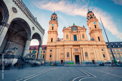 Colorful evening view of Theatine Catholic Church of St. Cajetan. Picturesque autumn cityscape of Munich, Bavaria, Germany. Traveling concept background.