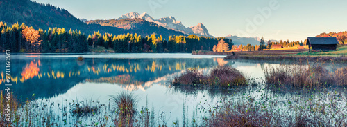 Marvelous morning panorama of Wagenbruchsee (Geroldsee) lake with Zugspitze mountain range on background. Beautiful autumn view of Bavarian Alps, Germany, Europe. Instagram filter toning. photo