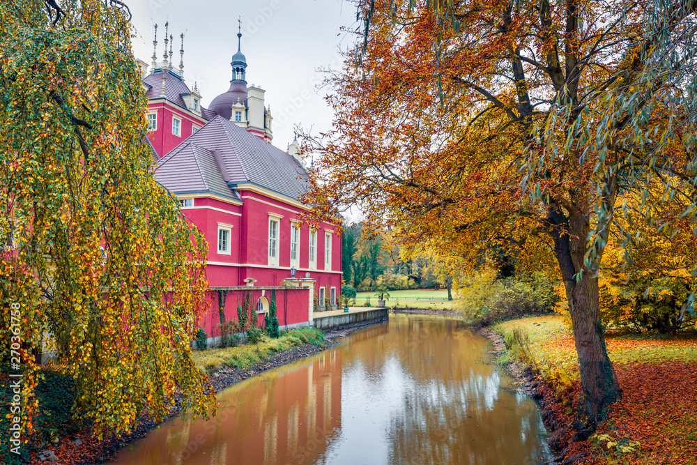 Fototapeta premium Picturesque autumn morning of Muskau castle. Nice morning scene in Muskau Park, UNESCO World Heritage Site, Upper Lusatia region, Saxony, Germany, Europe. Traveling concept background.