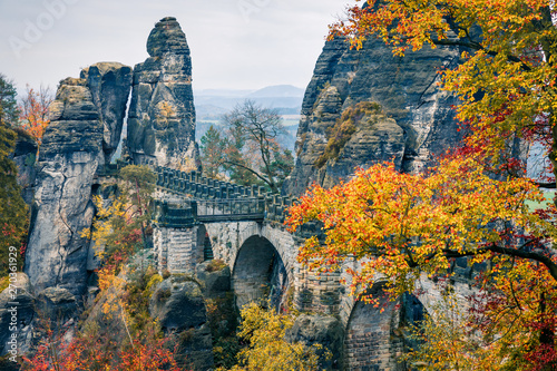 Exotic autumn view of sandstone rock. Great morning scene of Saxon Switzerland National Park, Germany, Europe. Beauty of nature concept background.
