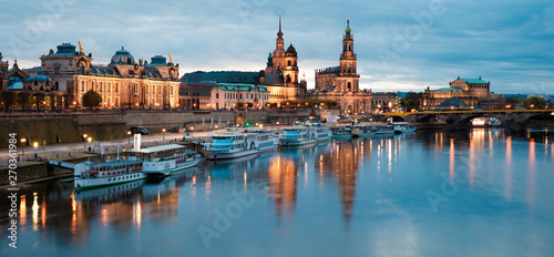 Stunning evennig panorama of Cathedral of the Holy Trinity or Hofkirche, Bruehl's Terrace or The Balcony of Europe. Beautiful autumn sunset on Elbe river in Dresden, Saxony, Germany, Europe.