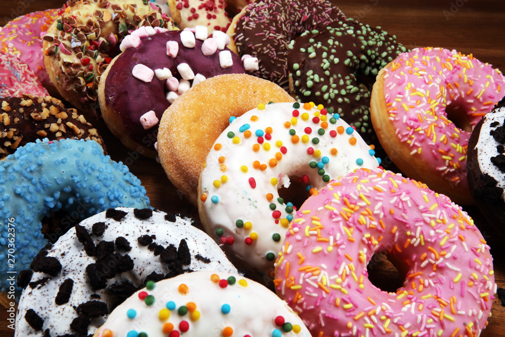 donuts in different glazes with chocolate donuts in different glazes with chocolate