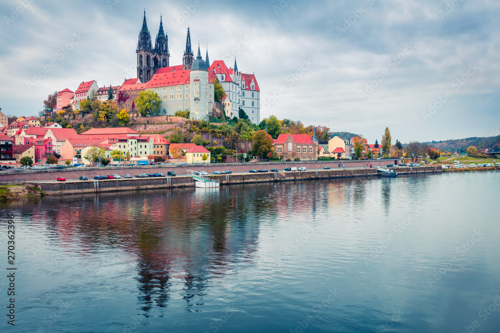 Dramatic autumn sceneof oldest overlooking the River Elbe castle - Albrechtsburg. Misty veneig cityscape of Meissen, Saxony, Germany, Europe. Traveling concept background.