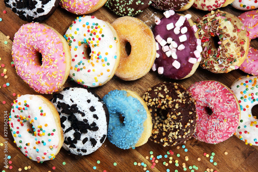 donuts in different glazes with chocolate donuts in different glazes with chocolate