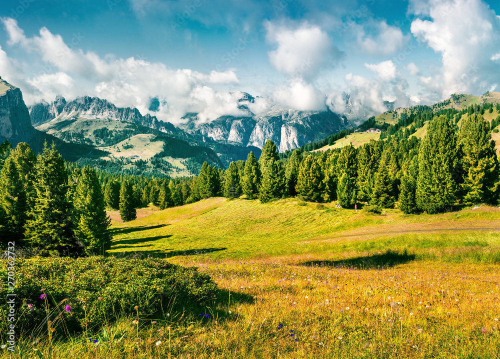 Wonderful summer scene with Furchetta mountain range in the morning mist. View Great view of Dolomite Alps from Sella pass, Italy, Europe. Beauty of nature concept background.