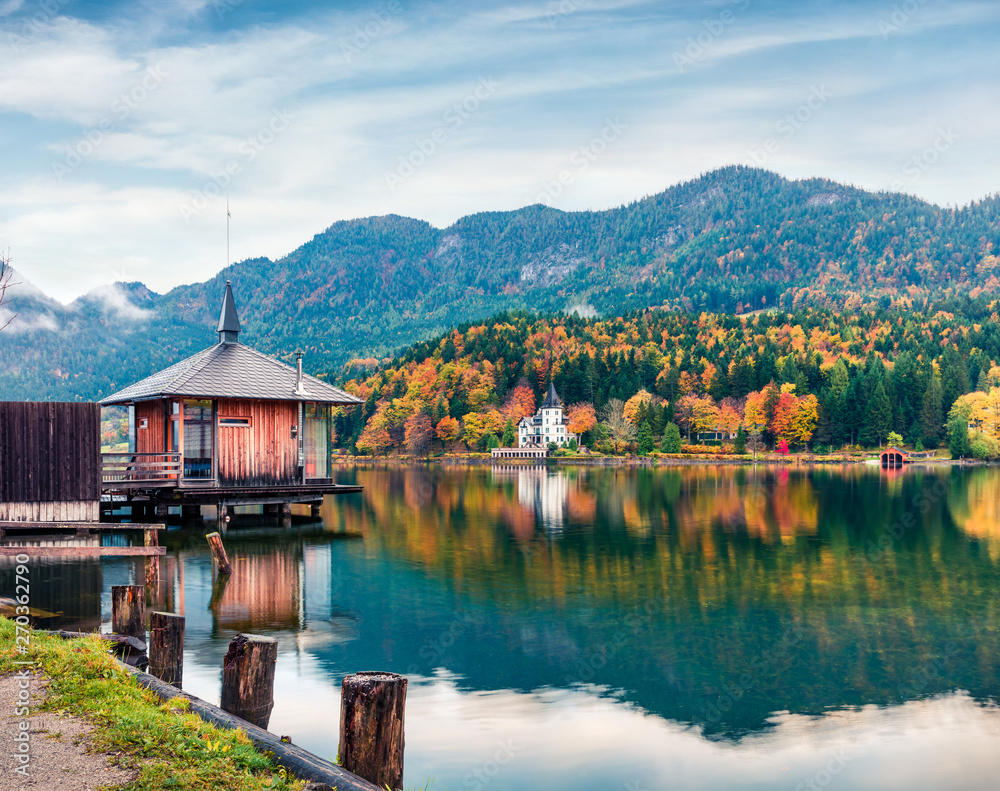 Fototapeta premium Fabulous autumn view of Grundlsee lake. Amazing morning scene of Brauhof village, Styria stare of Austria, Europe. Colorful view of Alps. Traveling concept background.