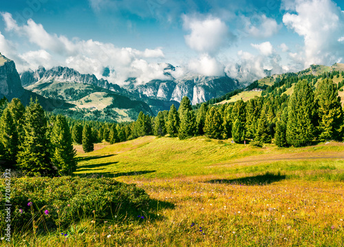 Wonderful summer scene with Furchetta mountain range in the morning mist. View Great view of Dolomite Alps from Sella pass  Italy  Europe. Beauty of nature concept background.