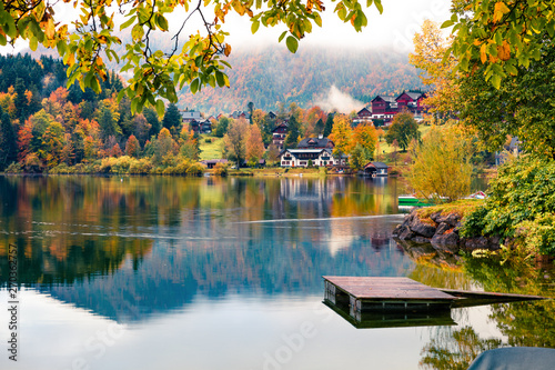 Spectacular autumn view of Grundlsee lake. Amazing morning scene of Brauhof village, Styria stare of Austria, Europe. Colorful view of Alps. Traveling concept background. photo