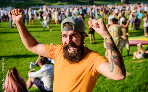 Happy winner. Happy bearded man shouting and making winner gesture on summer day. Emotional guy with mustache and beard on happy face. Brutal hipster with happy emotions wearing stylish baseball cap