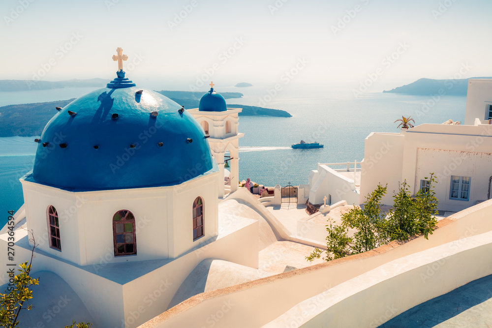 Fototapeta premium Sunny morning view of Santorini island. Splendid spring scene of the famous Greek resort Fira, Greece, Europe. Traveling concept background.