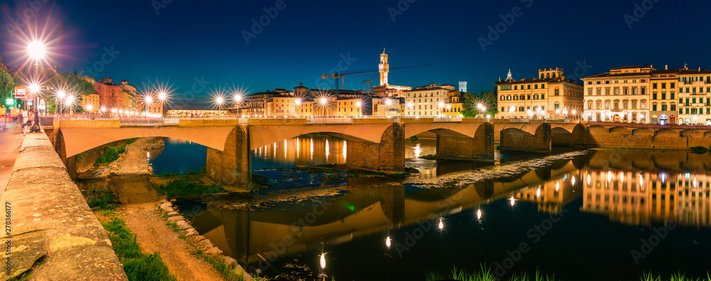 Great evening scene with Ponte alle Grazie bridge over Arno river. Enchanted night view of Florence, Italy, Europe. Traveling concept background.