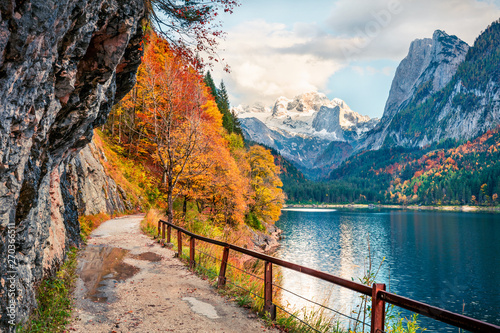 Fototapeta Naklejka Na Ścianę i Meble -  Splendid autumn scene of Vorderer ( Gosausee ) lake with Dachstein glacieron background. Picturesque morning view of Austrian Alps, Upper Austria, Europe. Traveling concept background.