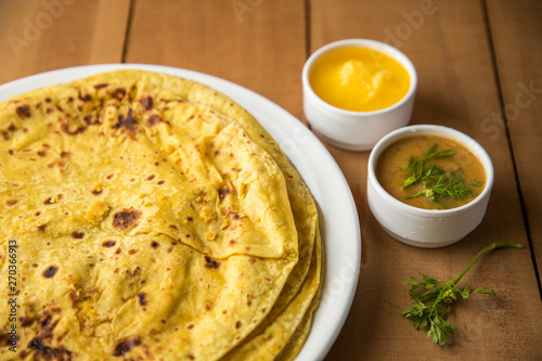 Holi festival, Traditional Maharashtrian food on the occasion of Holi. Puranpoli made of Jaggery. And cold drink made of curd. photo