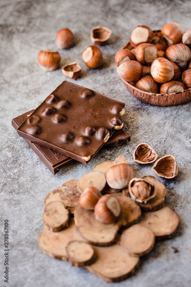 Homemade hazelnut chocolate bar. Nuts and chocolate background. Ingredients for cooking homemade chocolate sweets. Confectionery and sweets concept Homemade hazelnut chocolate bar. Nuts and chocolate background. Ingredients for cooking homemade chocolate sweets. Confectionery and sweets concept