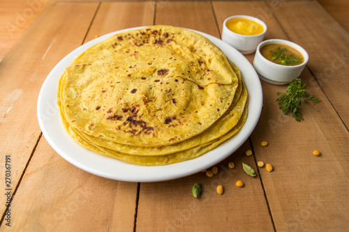 Holi festival, Traditional Maharashtrian food on the occasion of Holi. Puranpoli made of Jaggery. And cold drink made of curd. photo
