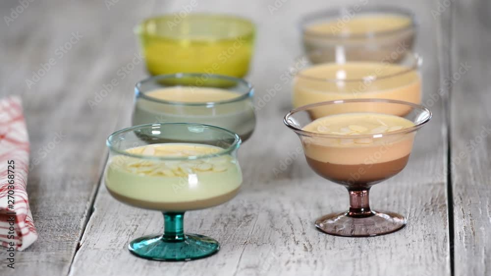 Sprinkle mousse dessert in glasses with almond petals Sprinkle mousse dessert in glasses with almond petals