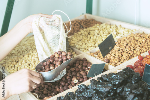 woman is bying products in zero waste shop