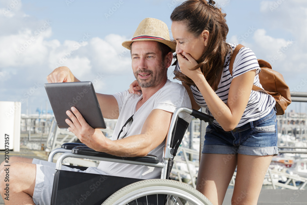 disabled man with digital tablet