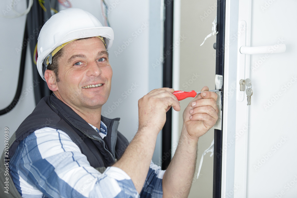 happy builder installing a window happy builder installing a window