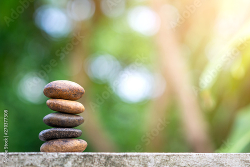 Balance stone with spa on bokeh nature background