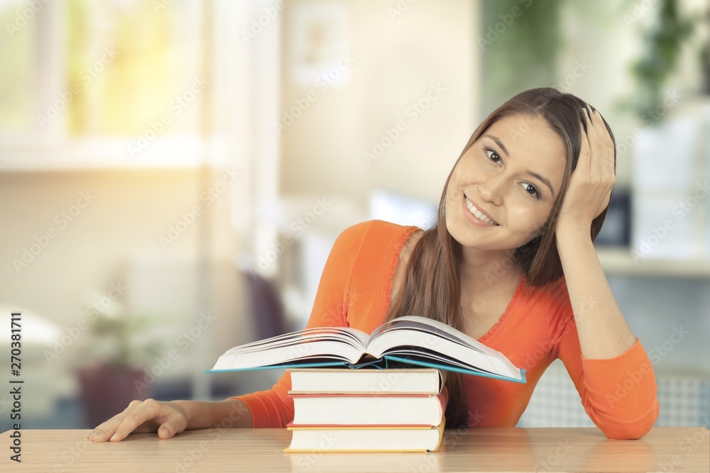 Young female student reading books Young female student reading books