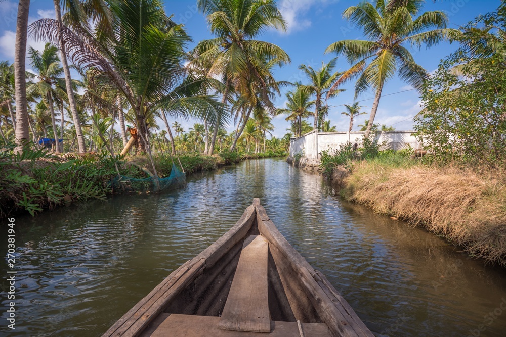 Canoe ride through backwater canals in Munroe Island