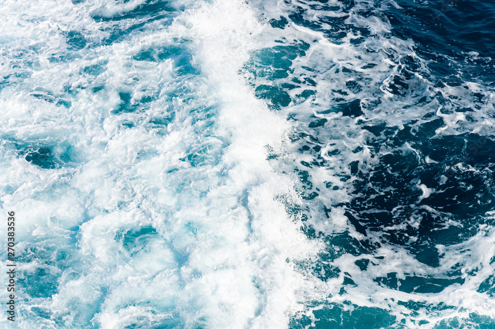 Obraz premium Blue sea water with foam