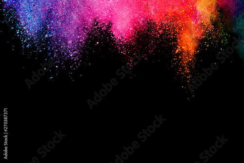 Abstract powder splatted background. Colorful powder explosion on black background. Colored cloud. Colorful dust explode. Paint Holi.