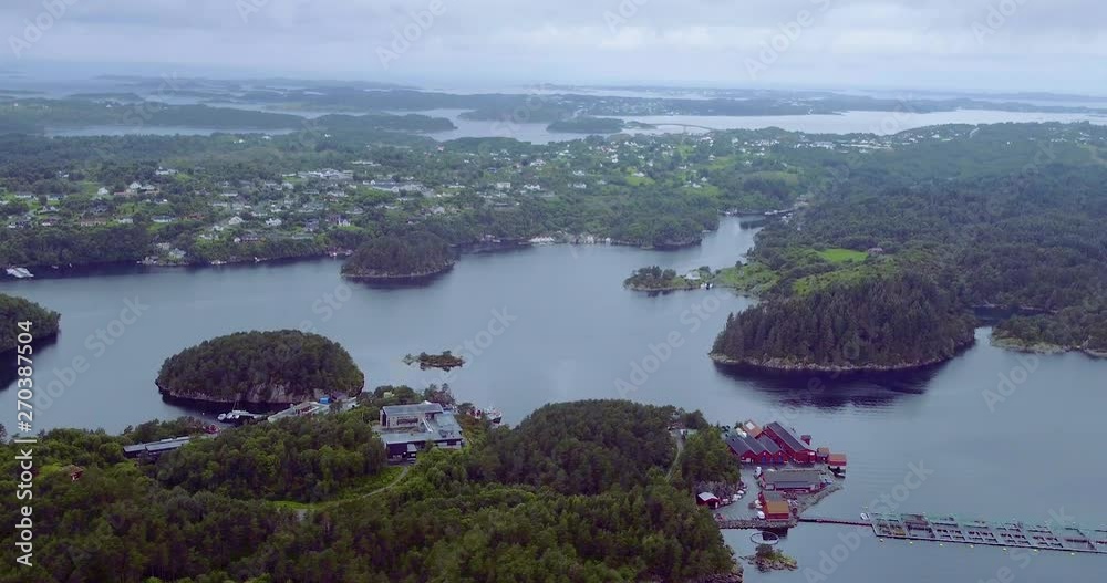 Aerial drone tracking right shot of a town on the Fjords of Norway
