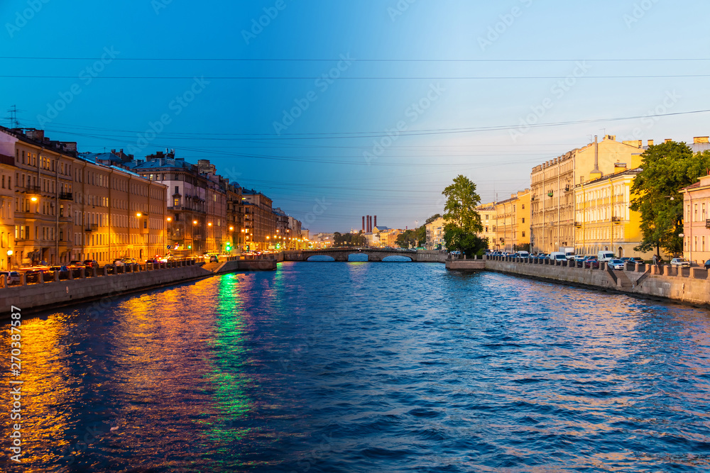Time-lapse collage of day to night transition. Beautiful view of the Fontanka River and historic buildings from the Krasnoarmeyskiy bridge, Saint Petersburg, Russia