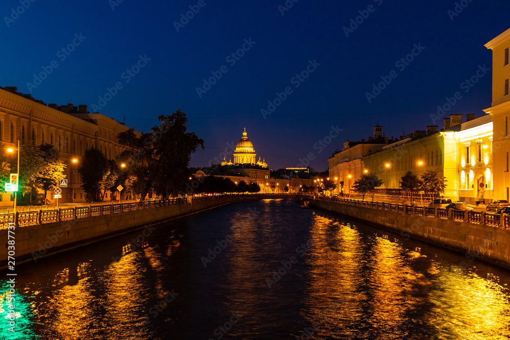 Beautiful night view of the Moyka River and historic buildings from the Potseluev bridge, Saint Petersburg, Russia
