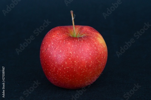 red apple on black background